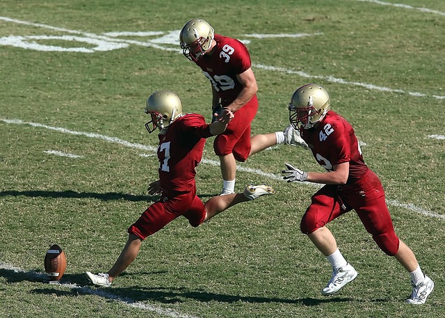 kickoff at a football game, seen from the side