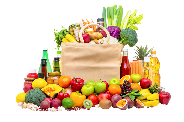canvas grocery bag overflowing with fruits and veggies of every color