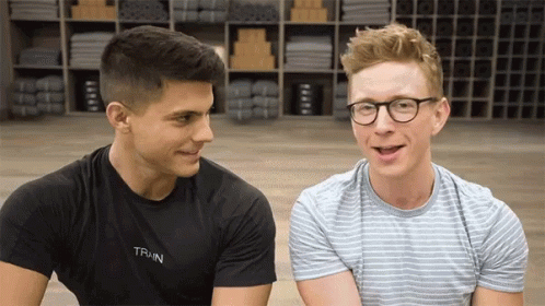 two boys in t-shirts in frame. one snaps fingers and they're suddenly in workout gear with headbands and wristbands on.
